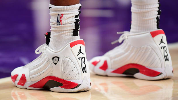 View of white and red Air Jordan sneakers.